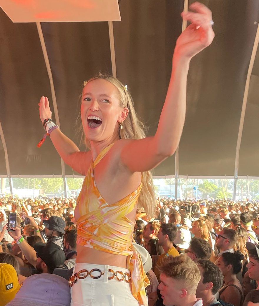 Hales on a friend's shoulders at Coachella