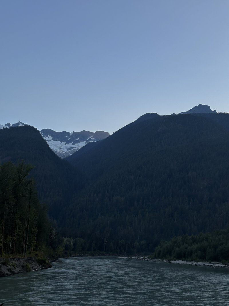 Snow-capped mountains above a river